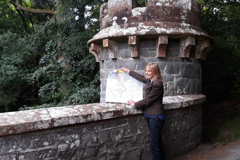 Catherine Maxwell Stuart with a map showing plans for the footpath network
